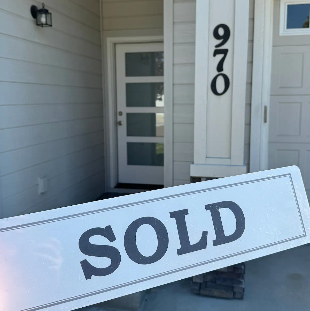 Happy Seller, Janice F., celebrating the sale of her remodeled townhome with Sidell and Barkes.